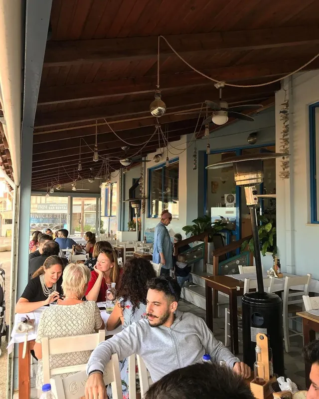 A seafront fish taverna terrace in Nea Chora, Chania