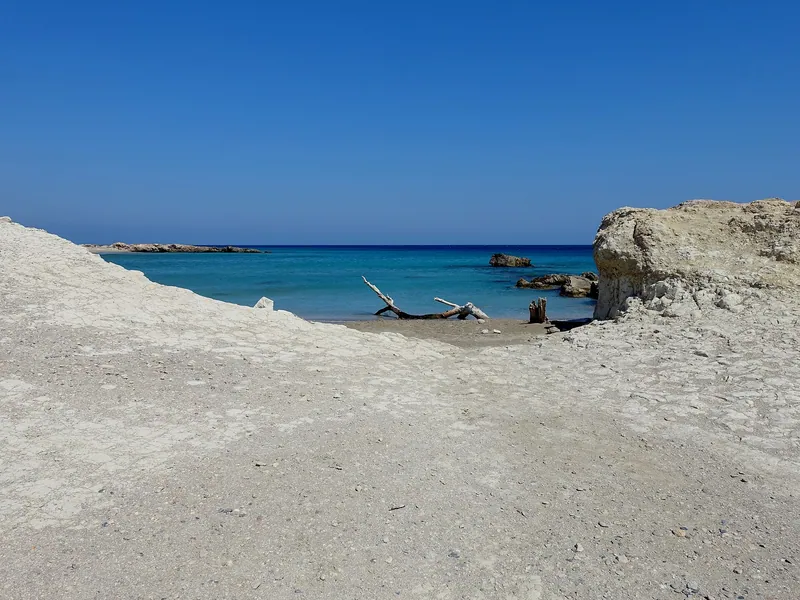 Argilos Beach and pale cliffs beside the water at Xerokampos