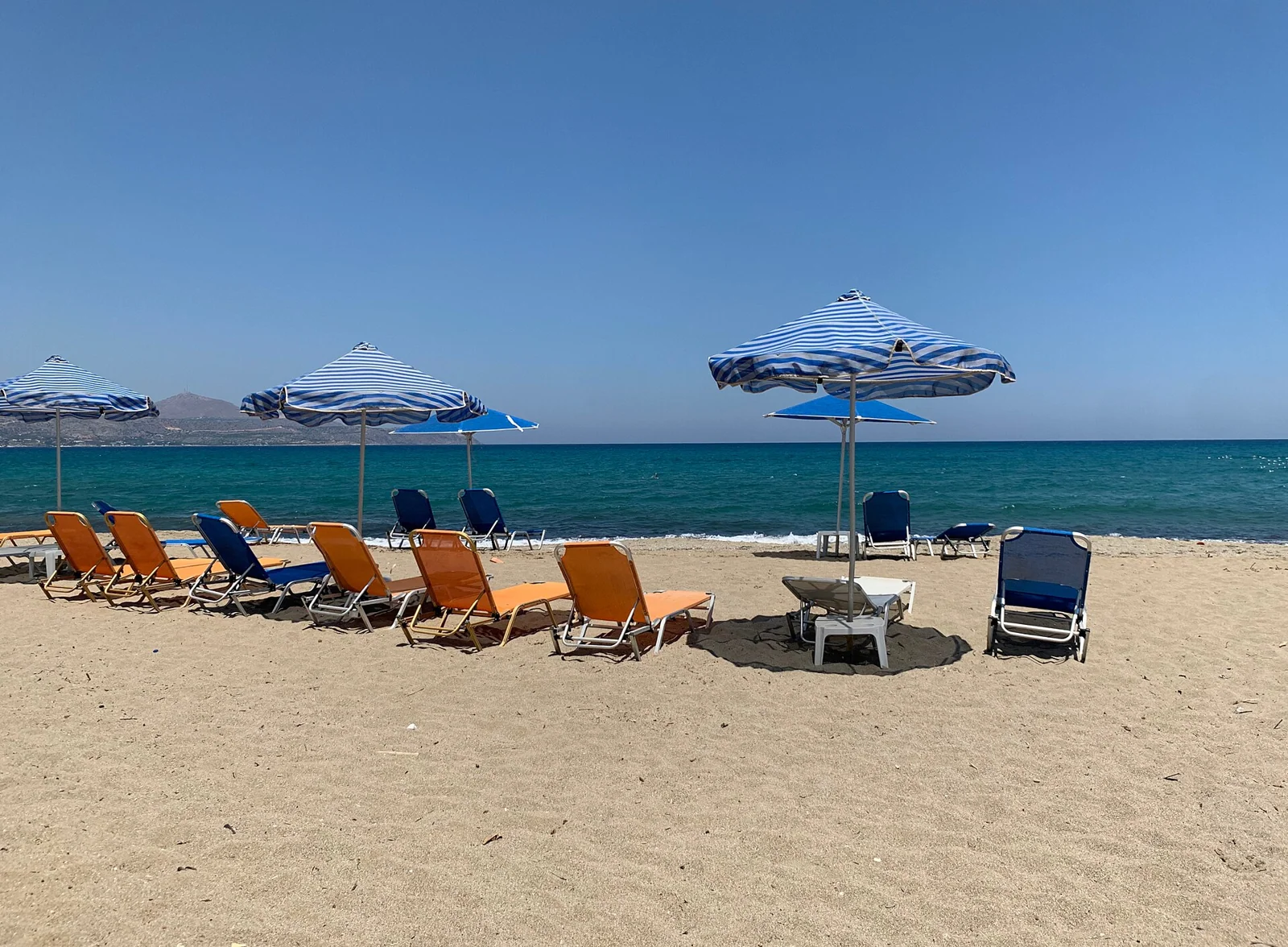 Sunbeds on the sand at Kalyves